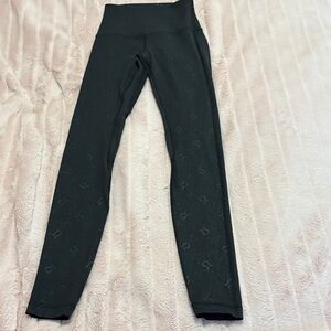 lululemon athletica Black Leggings with logo all over. RARE